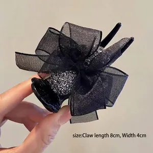 Detail of 8cm black mesh bow hair claw clip with silver glitter accents and dimensions