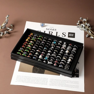 Black 100-slot ring display box with transparent lid for jewelry storage and showcase