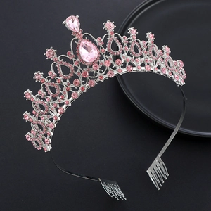 Close-up of pink crystal crown with teardrop rhinestones and silver alloy filigree detail