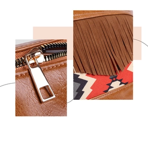 Detail of brown PU leather bag with golden metal zipper and ethnic woven tassel accents