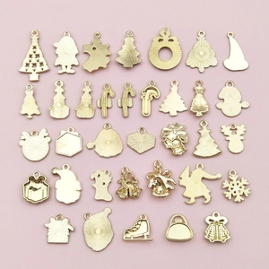 Golden Christmas alloy charms set featuring festive trees, Santa, and elk shapes for DIY