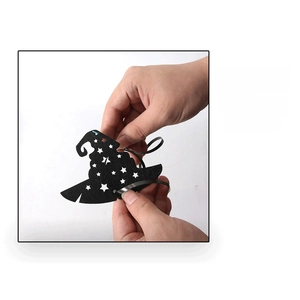 Detail of assembly showing black wizard hat decoration with star cutouts for Halloween