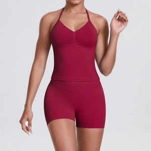 Detail view of burgundy seamless yoga set with halter top and high-waist shorts