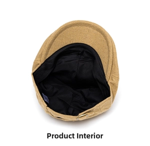 Internal view of wool newsboy cap showing the black lining and textured fabric detail