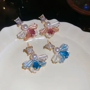 Elegant fan-shaped earrings with zircons and pearls in red and blue gradient colors