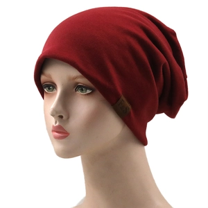 Breathable dark red slouchy beanie for men and women featuring a brown F&S leather label
