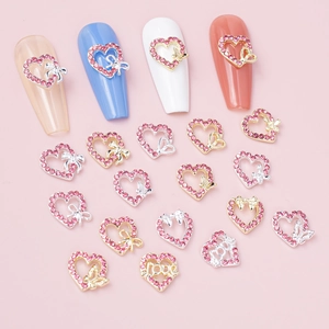 Pink heart rhinestones and hollow bow nail charms with Love motifs for DIY manicures