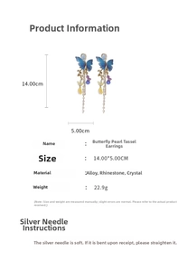 Detail showing blue mesh butterfly earrings with crystal tassels and silver needle
