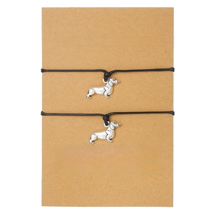 Set of two black rope bracelets with silver dachshund charms on gift card