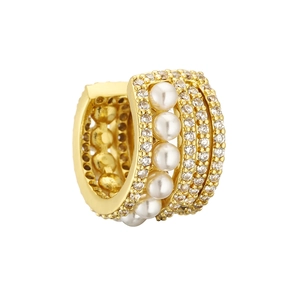 Close-up of golden multi-row ear cuff featuring four round pearls and pavé white zirconias