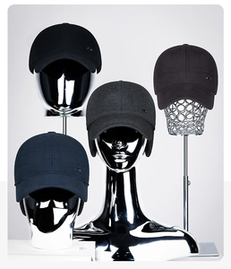 Detailed comparison of winter baseball caps with ear flaps in navy, black, and dark grey