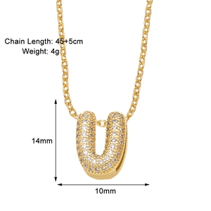 Detail showing dimensions of gold U-letter pendant necklace with white zircons