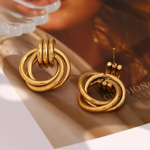Macro shot of 18K gold plated multi-layer hoop earrings with a high-polish finish