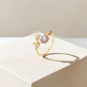 Detail of S925 silver adjustable flower ring with purple crystals and moonstone