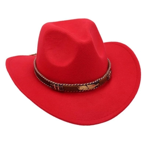 Detail of red cowboy hat with woven band, colorful beads and golden feather charm
