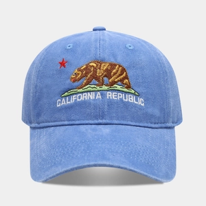 Close-up of California Republic bear embroidery on blue washed cotton baseball cap