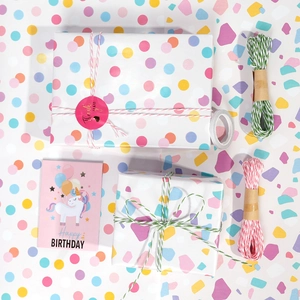 Star pattern gift wrapping paper set with rainbow dots, cotton twine and birthday card
