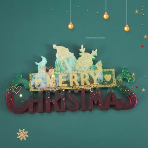 Detail of red and green gradient resin Merry Christmas hanging sign with reindeer design