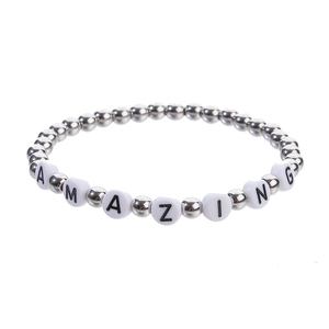 Detail shot of hematite beaded bracelet with silver beads and AMAZING letter charms