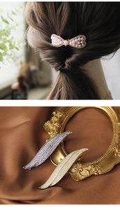 Detail of elegant leaf and bow hair clips with pearls and rhinestones on silk