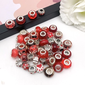 Red assorted glass and metal spacer beads with heart and flower patterns for DIY jewelry