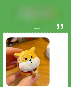 Macro detail of Shiba Inu resin dog figurine with realistic fur texture and red collar