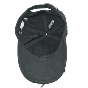Detailed bottom view of black distressed cotton baseball cap showing lining and labels