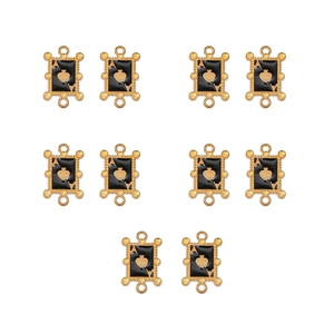 Macro shot of ten gold-tone alloy Ace of Spades charms with black enamel finish