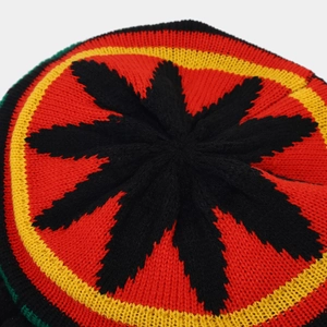 Rasta style knit beret hat with red yellow green black stripes and star pattern