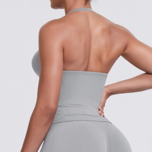 Close-up of seamless gray sports bra and leggings set with high-stretch knitted texture