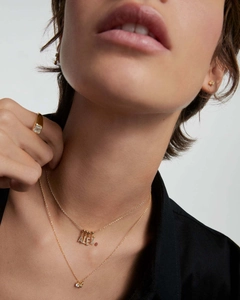 Detail of layered gold S925 silver necklace with ALEX diamond pendant on model