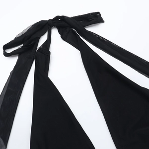 Close-up detail of sexy black mesh halter neck strap and texture on the mini dress