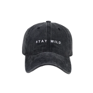 Vintage washed dark grey cotton baseball cap with white STAY WILD embroidery on the front