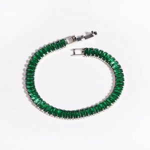 Detail view of green rectangular zircon tennis bracelet with silver metal setting