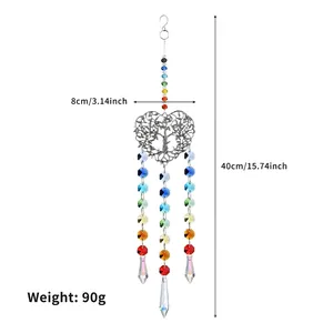 Detail of silver tree of life heart suncatcher with colorful crystal beads and prisms