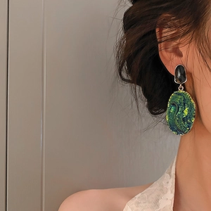 Retro oval drop earrings with textured green stone and irregular black stud for women