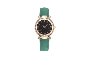 Detail of rose gold watch with starry sky dial and teal suede leather strap