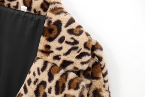 Detail shot of leopard print faux fur coat neckline with premium black satin lining
