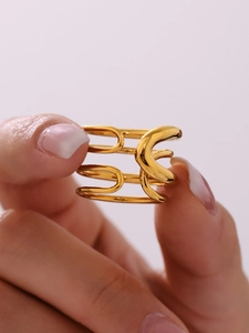Macro shot of minimalist gold layered geometric ring with polished finish design