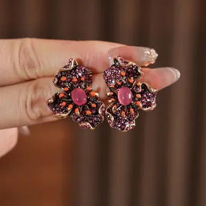 Vintage floral drop earrings with pink crystals and bronze finish for elegant women