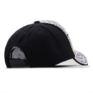 Black baseball cap with colorful rhinestones and adjustable strap shown from side view
