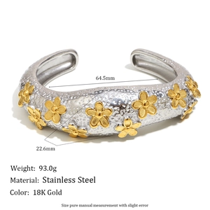 Exaggerated stainless steel flower bangle with 18K gold accents and silver finish