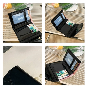 Interior detail of black patent leather folding wallet with card slots and an ID window
