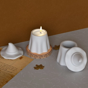 Detailed view of white ghost-shaped candle and ceramic jar for Halloween storage