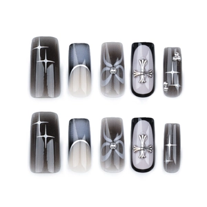 Gothic square press-on nails featuring black ombré design with metallic cross and stars