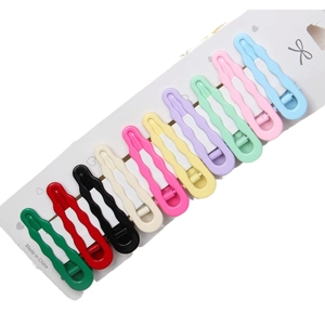 Set of 10 colorful 6cm wavy drop hair clips neatly arranged on a white display card