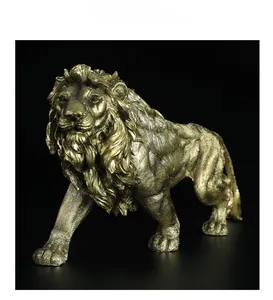 Close-up of golden lion resin sculpture with detailed mane texture on black background