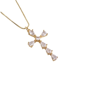 Elegant 18K gold plated cross pendant necklace featuring pear-cut cubic zirconia stones