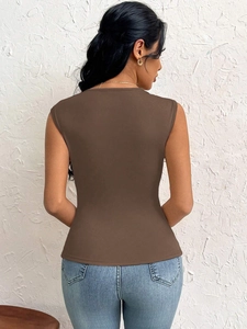 Slim fit brown sleeveless top showing elegant back tailoring and textured fabric finish