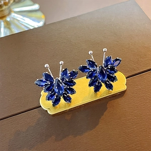 Sparkling blue zircon butterfly stud earrings with silver pins for a trendy feminine look